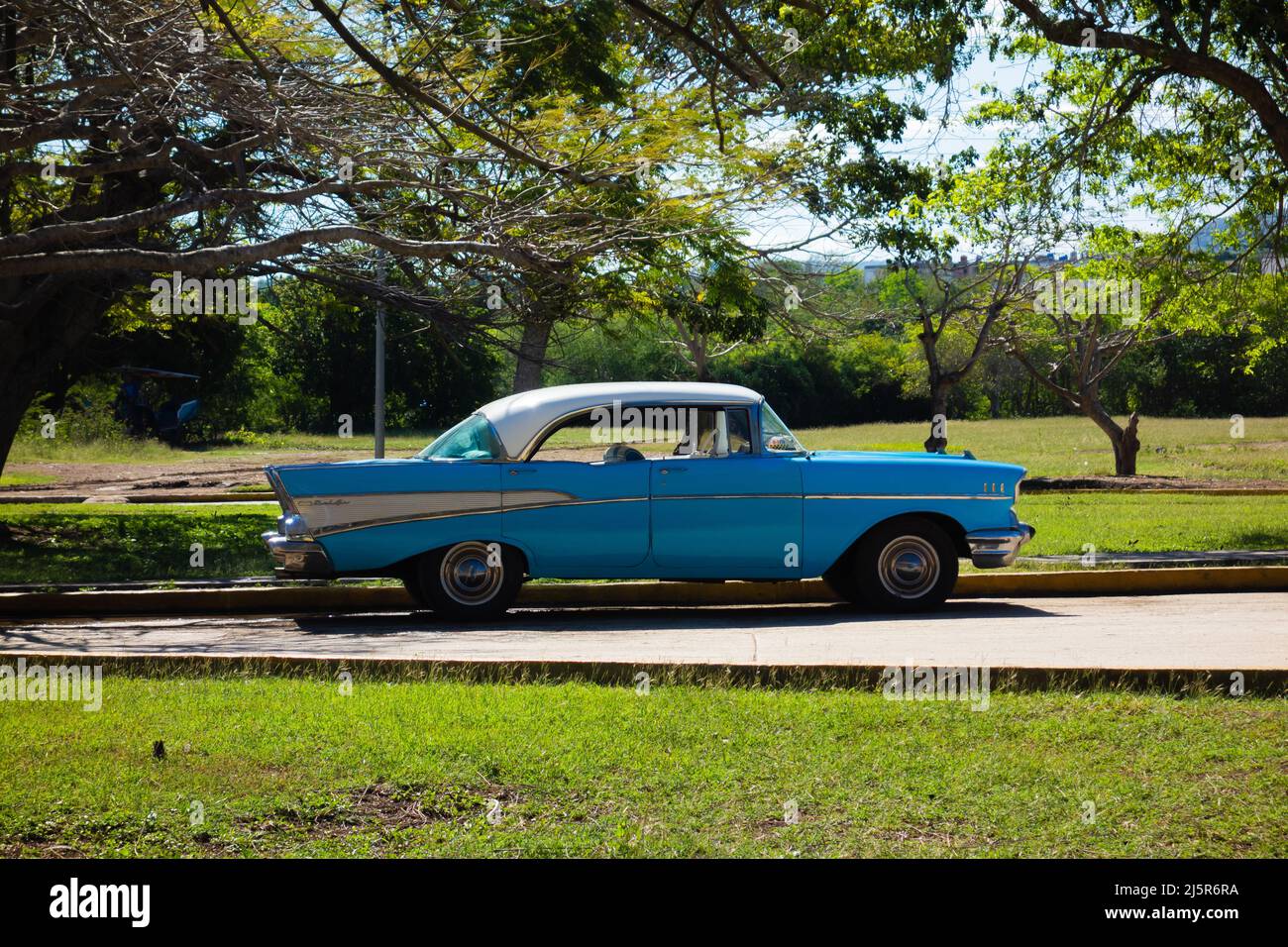 HOLGUIN, CUBA FEBRUARY 16; 2020 blue and white classic car parked