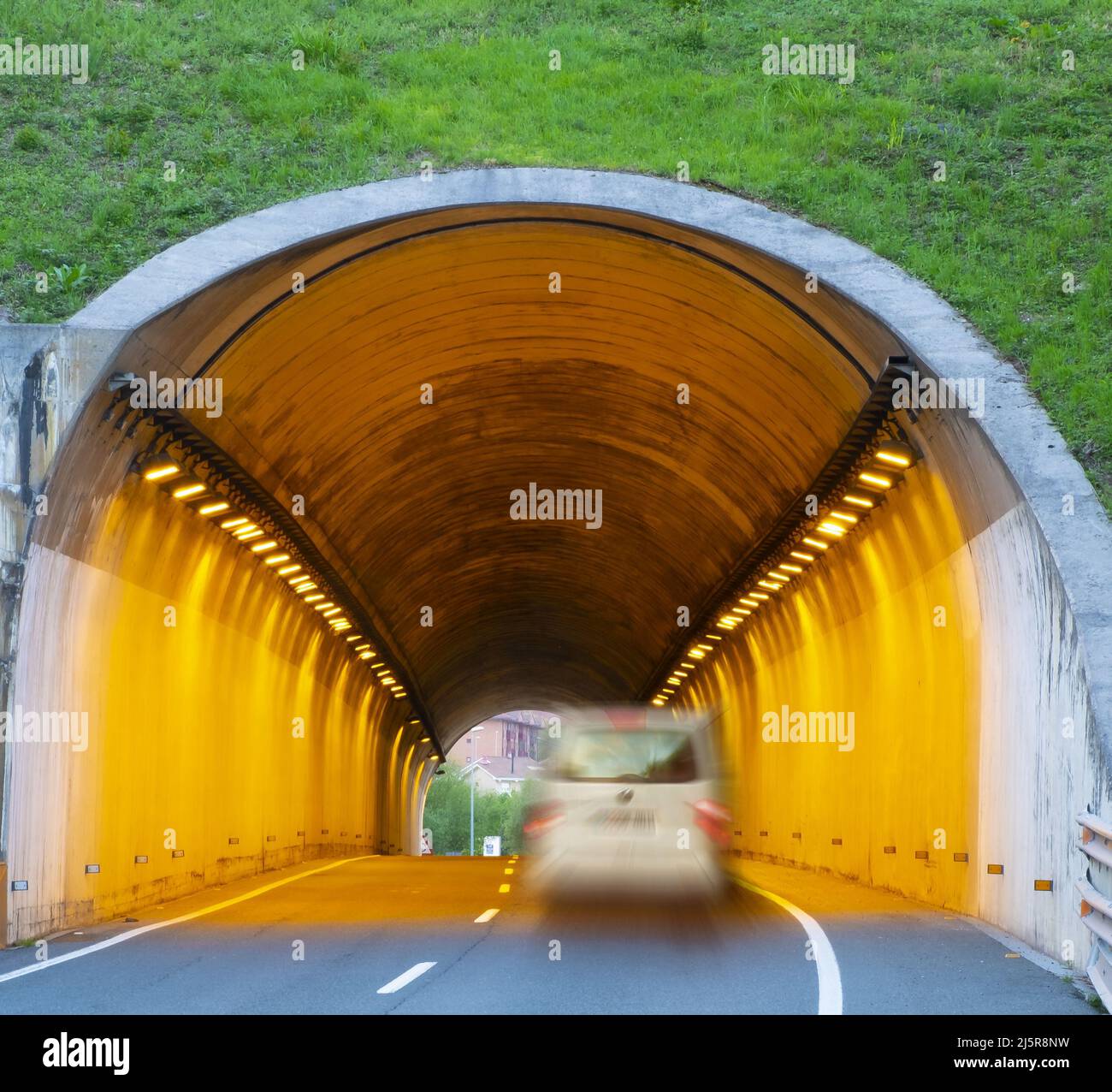 car driving at high speed through a tunnel Stock Photo Alamy