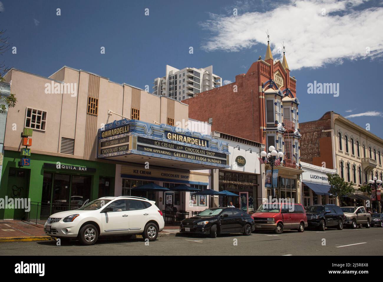 Ghirardelli chocolate shop and the beautiful Yuma building on the 5th Ave of the Gaslamp Quarter, San Diego Stock Photo
