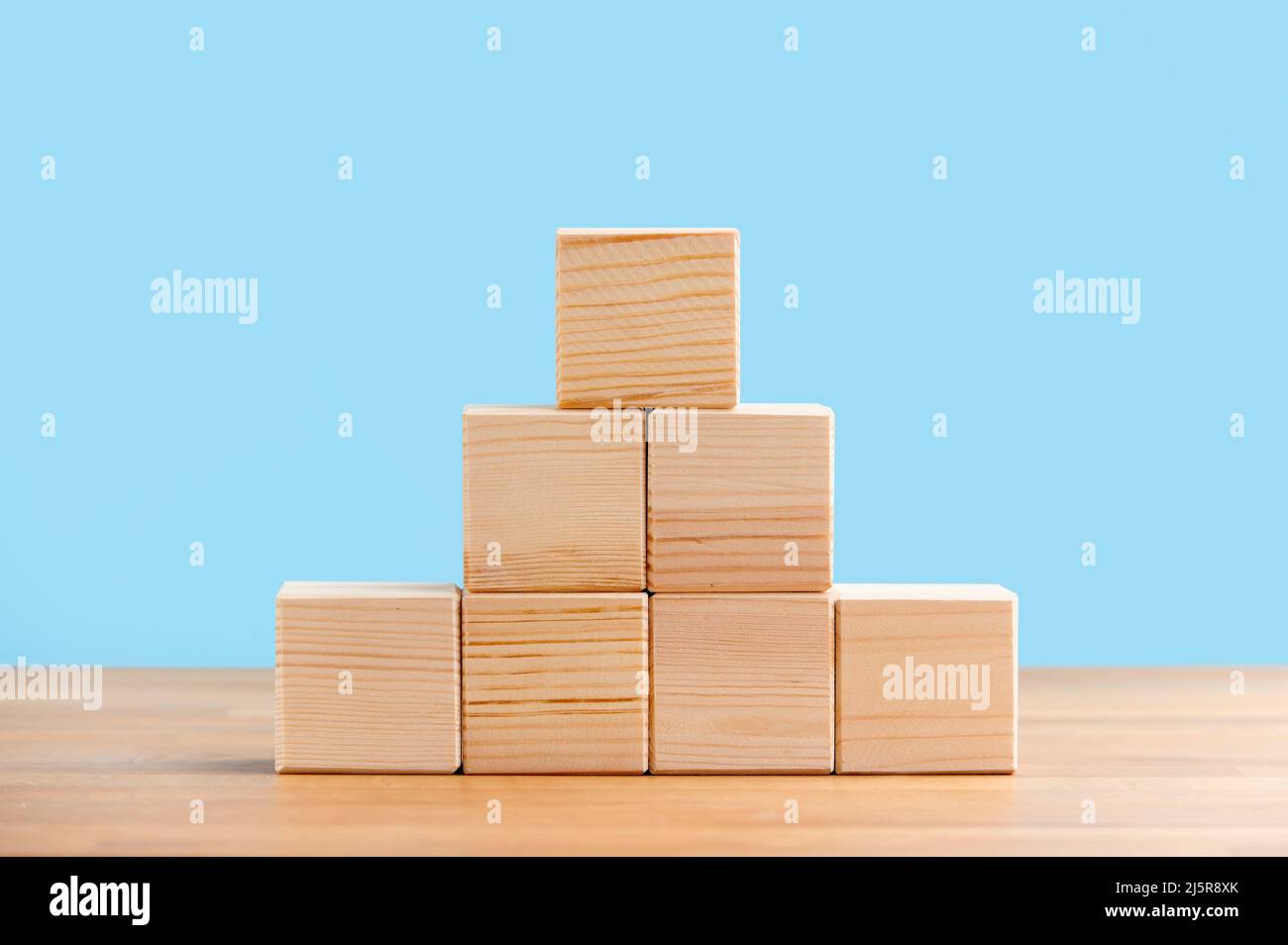 Blank wooden block cubes on a blue background for your text. free space for business concept template and banner.. Stock Photo
