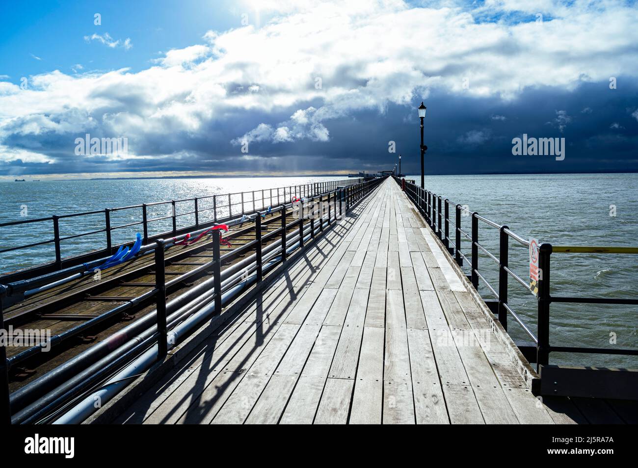Souhtend pier with an incoming storm. Stock Photo