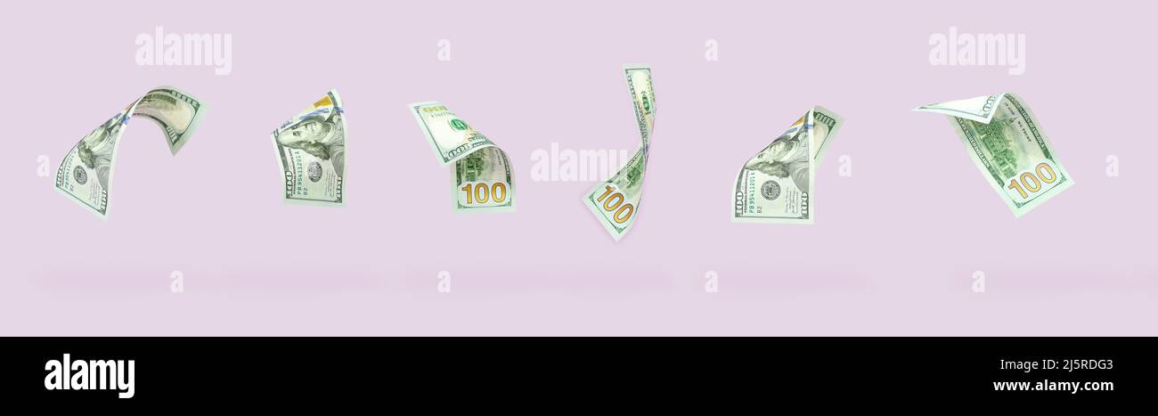 Set of flying one hundred dollars bills on pastel background. Flying of US dollar banknote on pink pastel background. Investment and saving concept Stock Photo