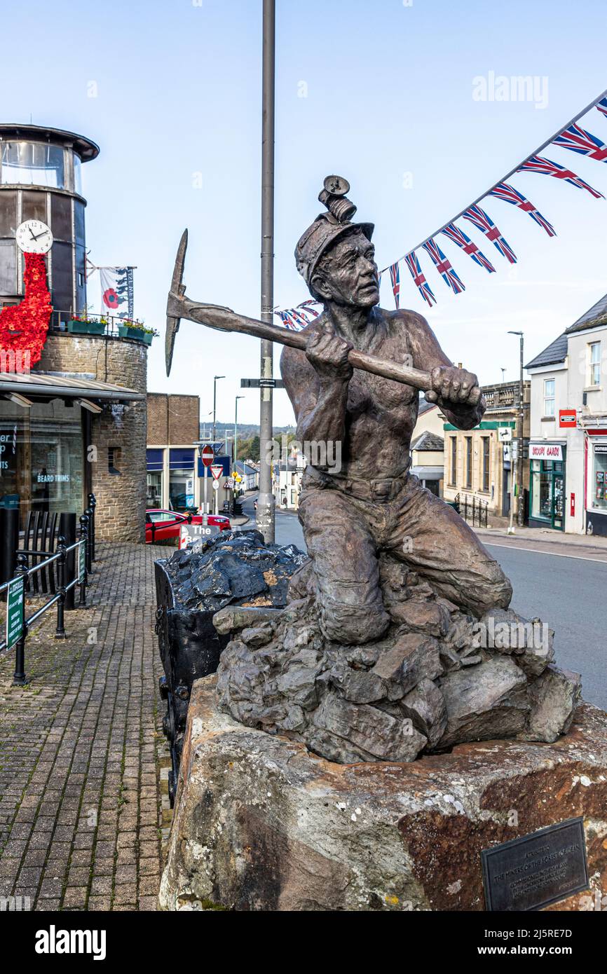 A statue of a coal miner by Anthony Dufort erected in 2000 as 'A tribute to the miners of the Forest of Dean' in the Forest of Dean town of Cinderford Stock Photo