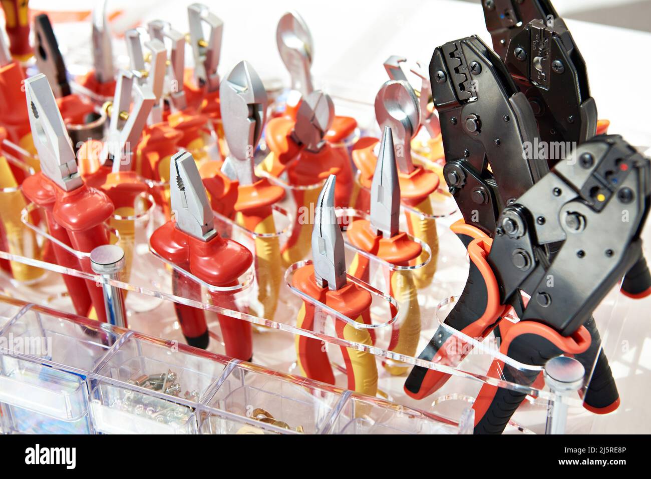 Red pliers in hardware store Stock Photo