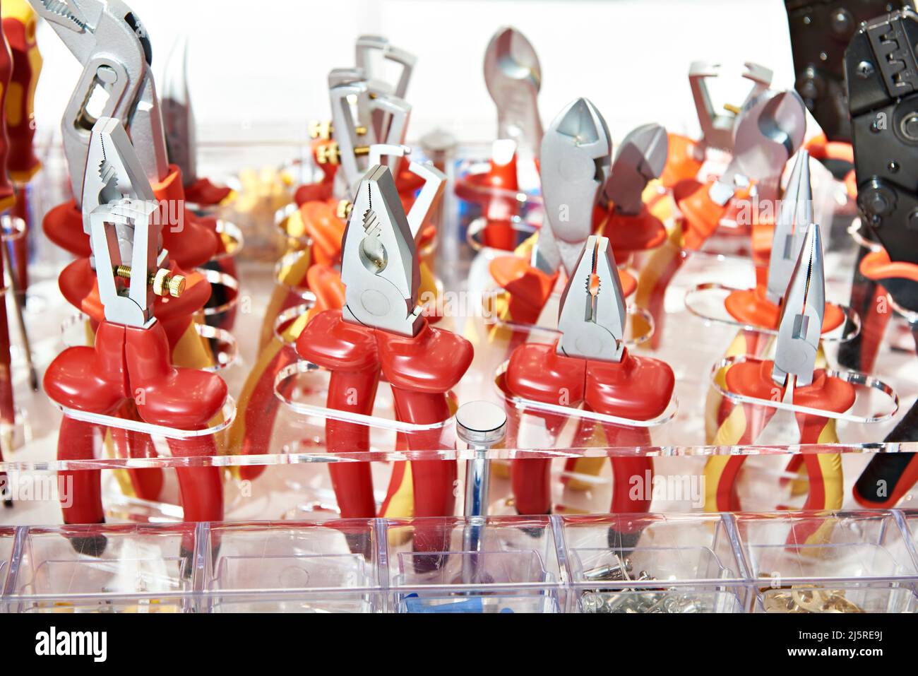 Red pliers in hardware store Stock Photo