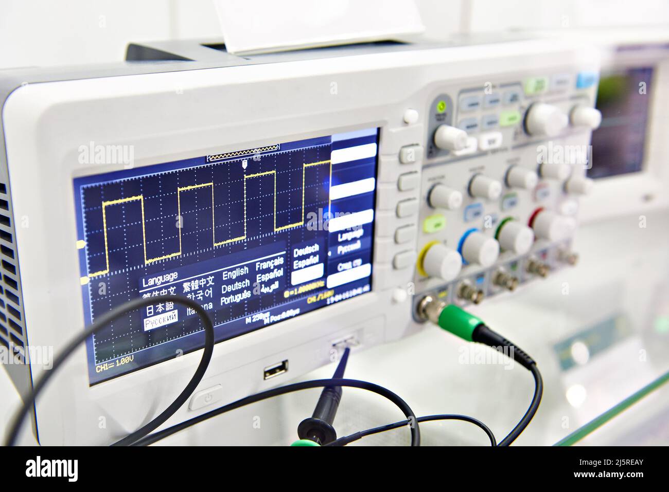 Modern digital oscilloscope in laboratory Stock Photo