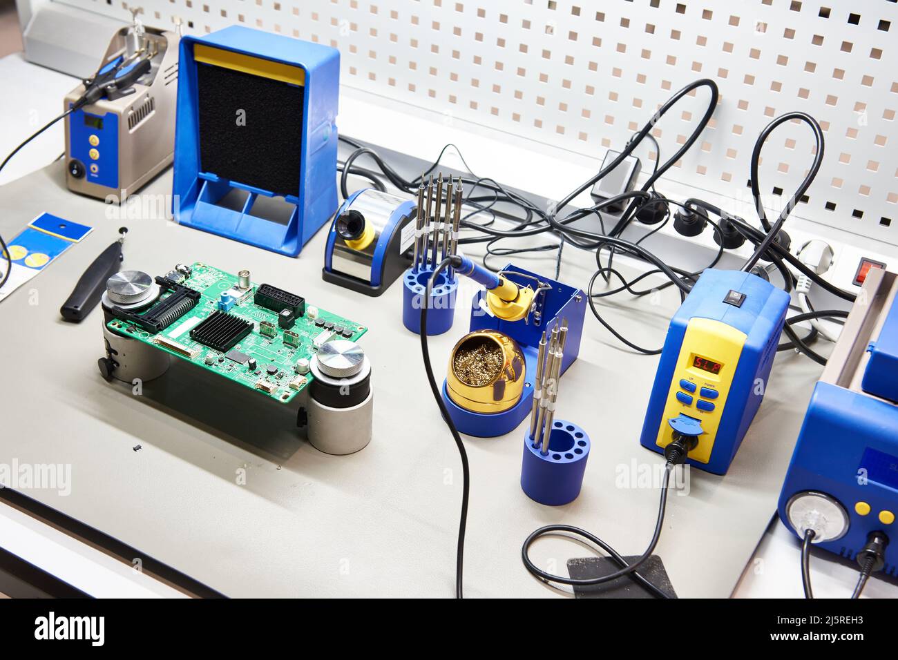 Workplace with a soldering iron and a tool for electronics and