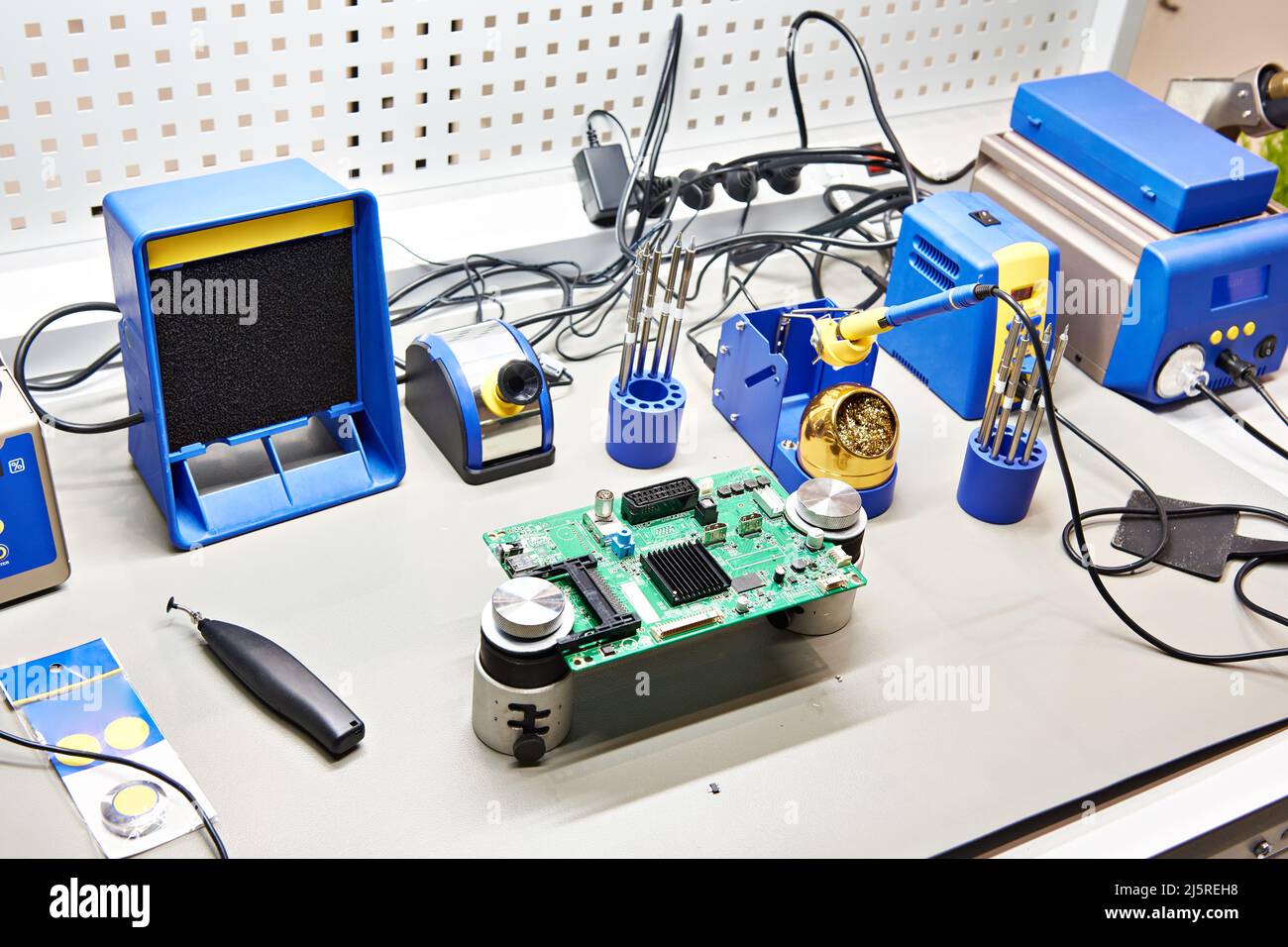 Workplace with a soldering iron and a tool for electronics and components Stock Photo