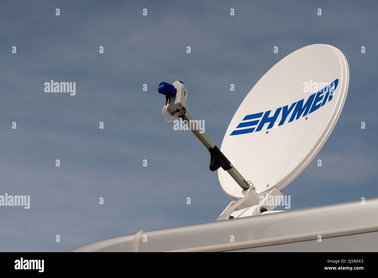 Satellite dish or antenna reflector as Oyster Vision single satellite system on Hymer motorhome Stock Photo