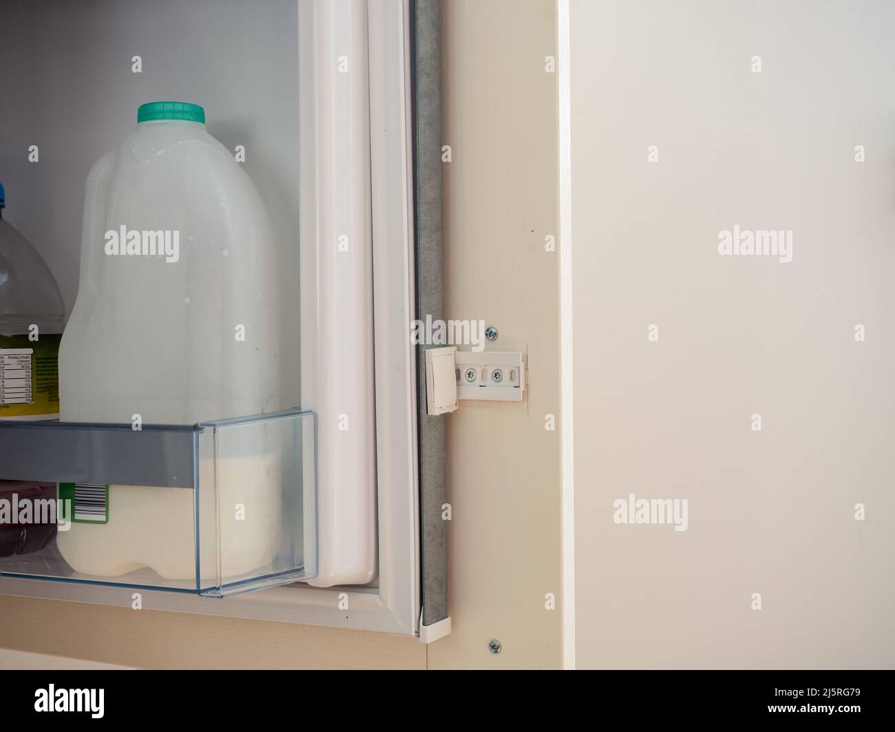 integrated  fridge freezer door bracket assembly sliding mechanism Stock Photo