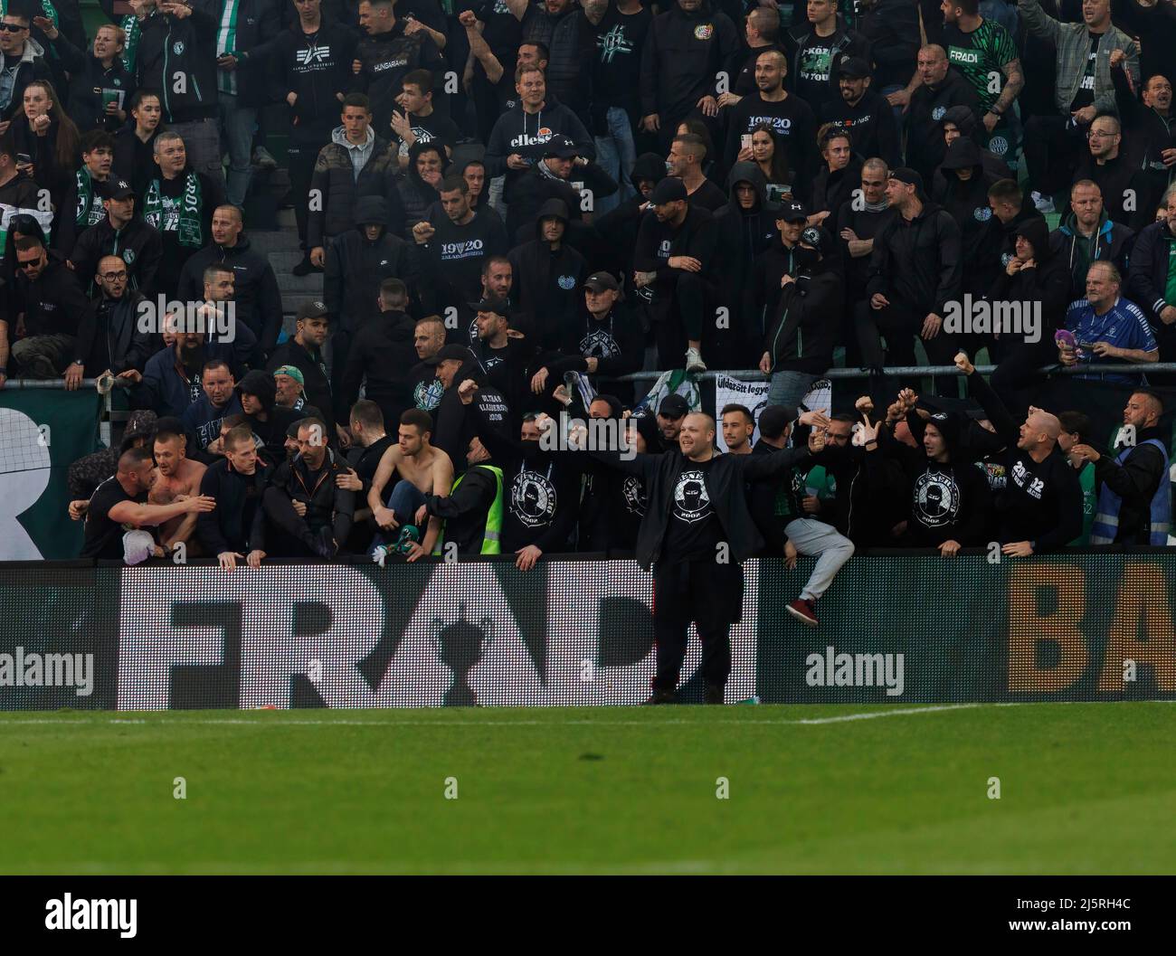 BUDAPEST, HUNGARY - APRIL 24: Ultra fans of Ferencvarosi TC (as known as  Green Monsters) celebrate the victory after the Hungarian OTP Bank Liga  match between Ferencvarosi TC and Ujpest FC at