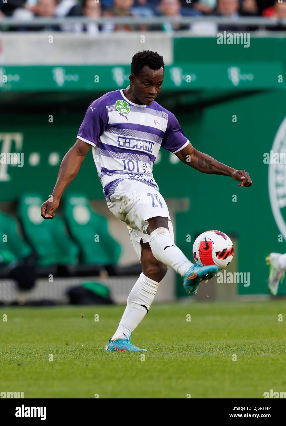 Branko Pauljevic of Ujpest FC competes for the ball with Tokmac