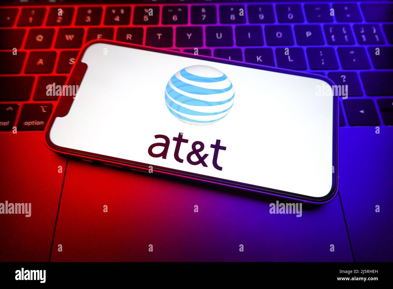 In this photo illustration, an AT&T logo seen displayed on a smartphone ...