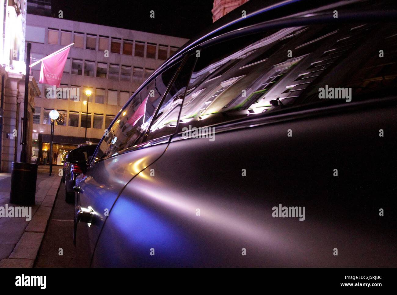 A brand new Mercedes electric black mat was parked outside a 