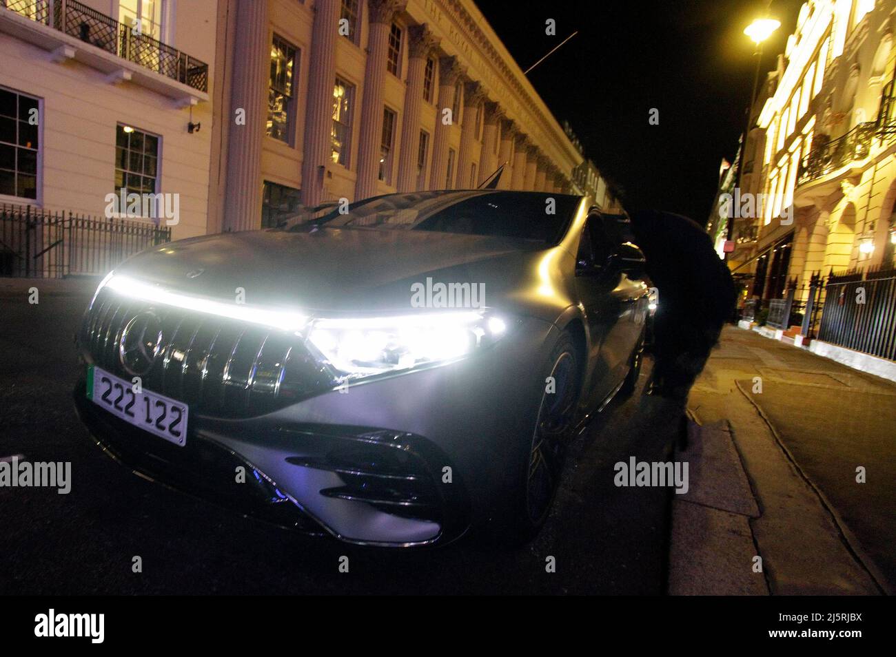 A brand new Mercedes electric black mat was parked outside a 