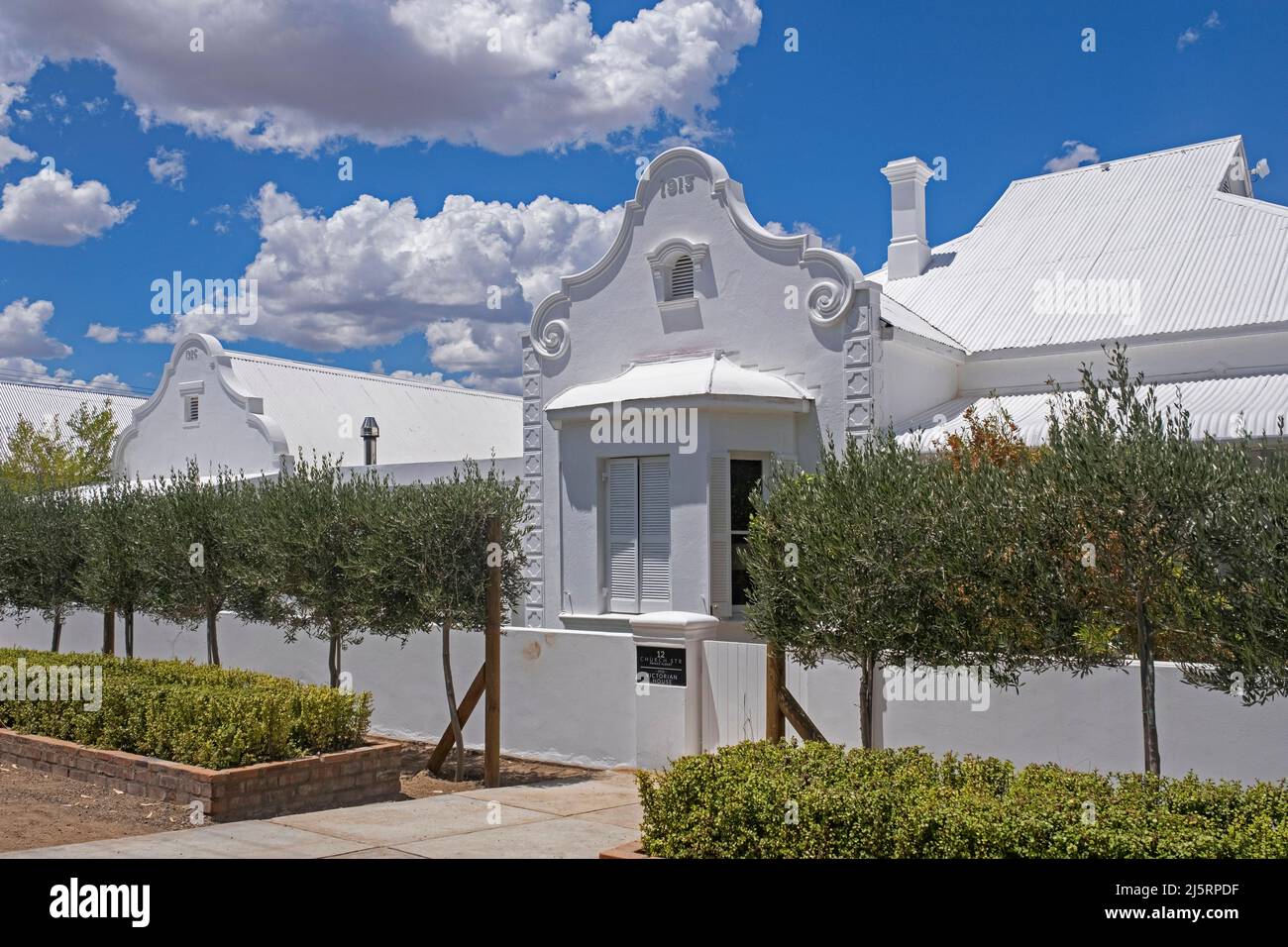 White house with traditional Cape Dutch gable at Prince Albert, picturesque Victorian town in