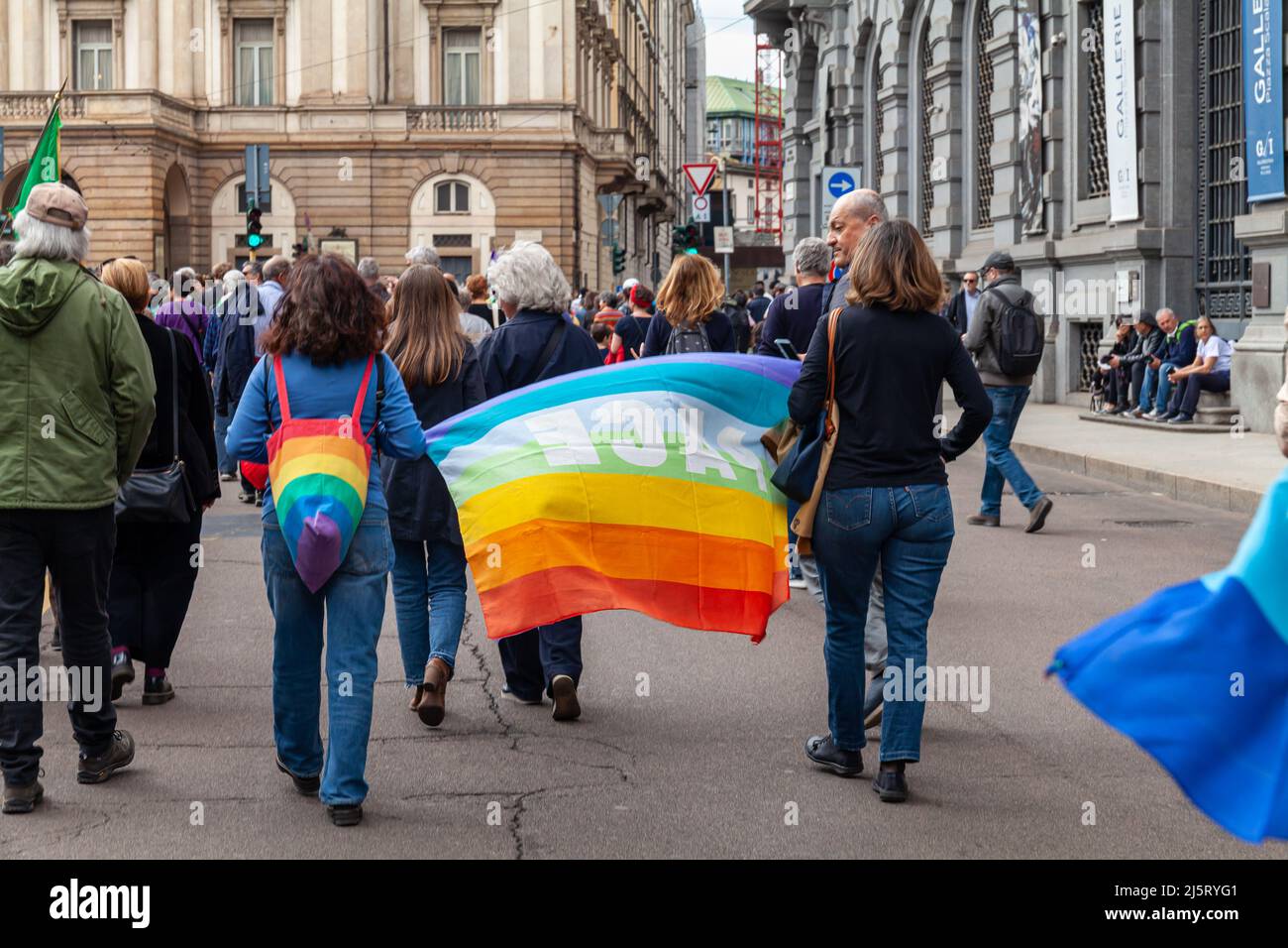 Demonstration for peace, for people's rights, against Russia-Ukraine war. Rainbow flags of peace. April 25th, Milan, Italy. Stock Photo