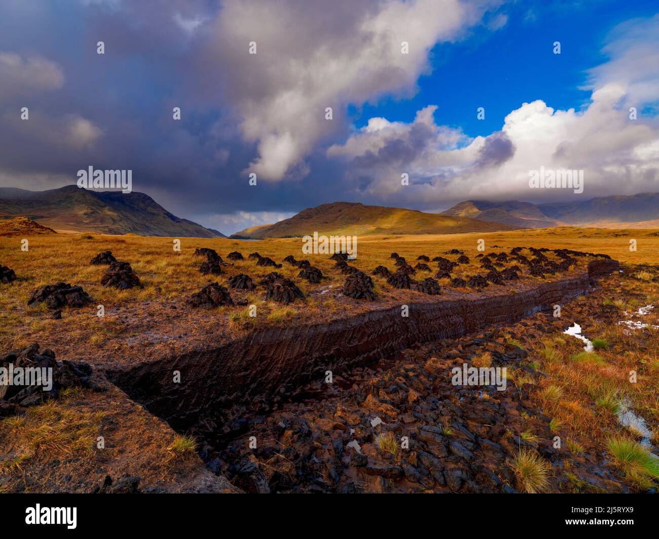 Peat, Turf cutting, looking towards Lough Fee, North Connemara, County Galway, Ireland Stock Photo