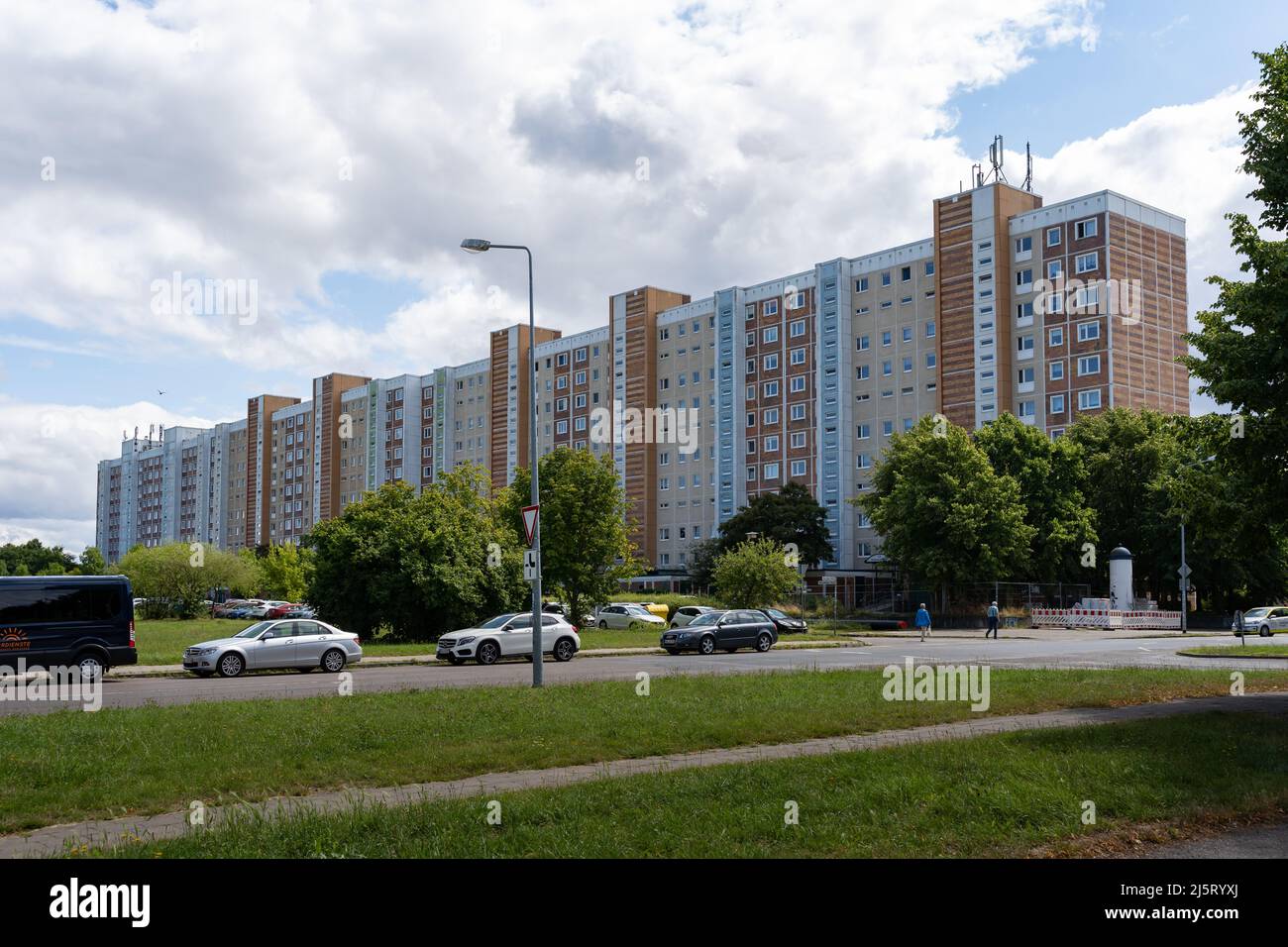 Huge residential building in Lichtenhagen. Facade of an old prefabricated house. Total view of the big building. Stock Photo