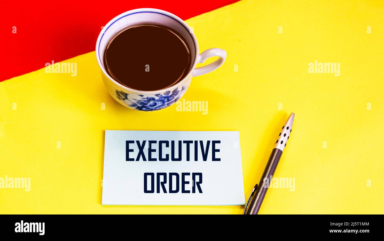 EXECUTIVE ORDER text on paper with coffee and pen. business concept Stock Photo