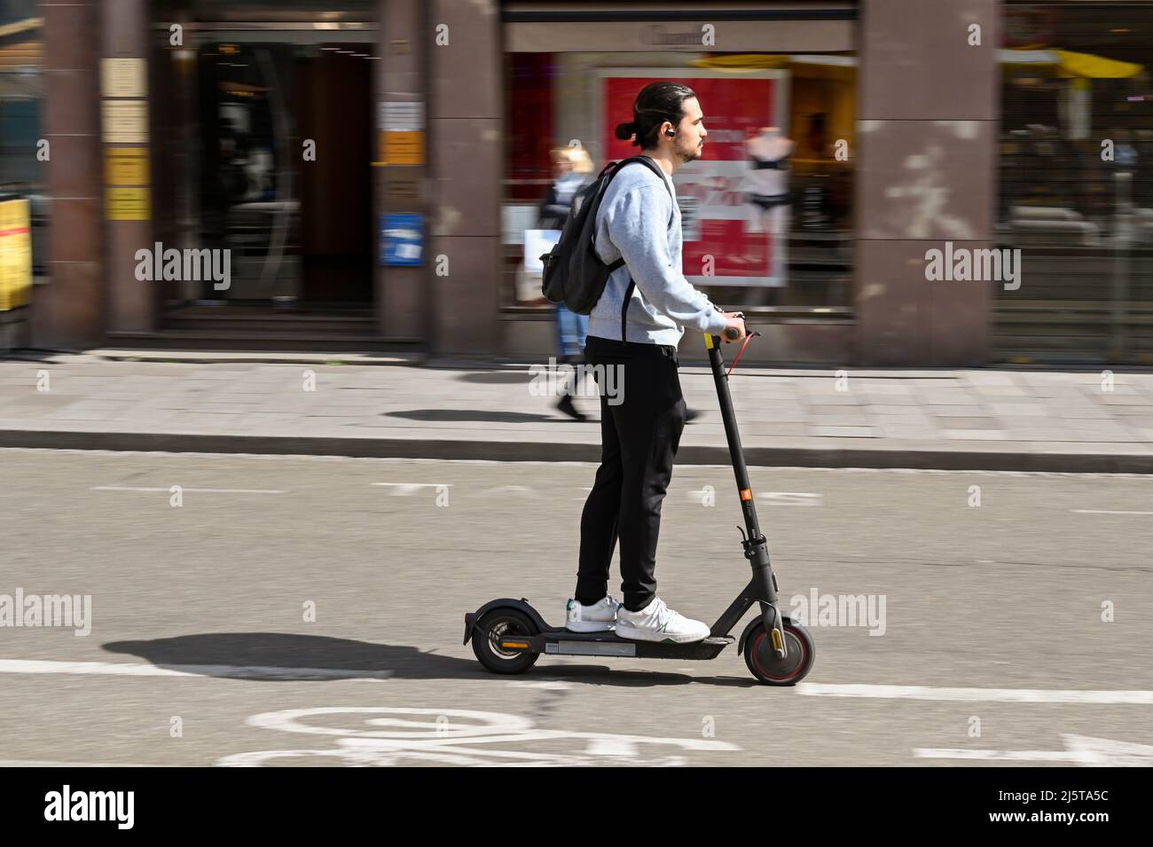 Strasbourg, France - April 2022: Person riding on an electric scooter on a  street in Strasbourg city centre with motion blur Stock Photo - Alamy