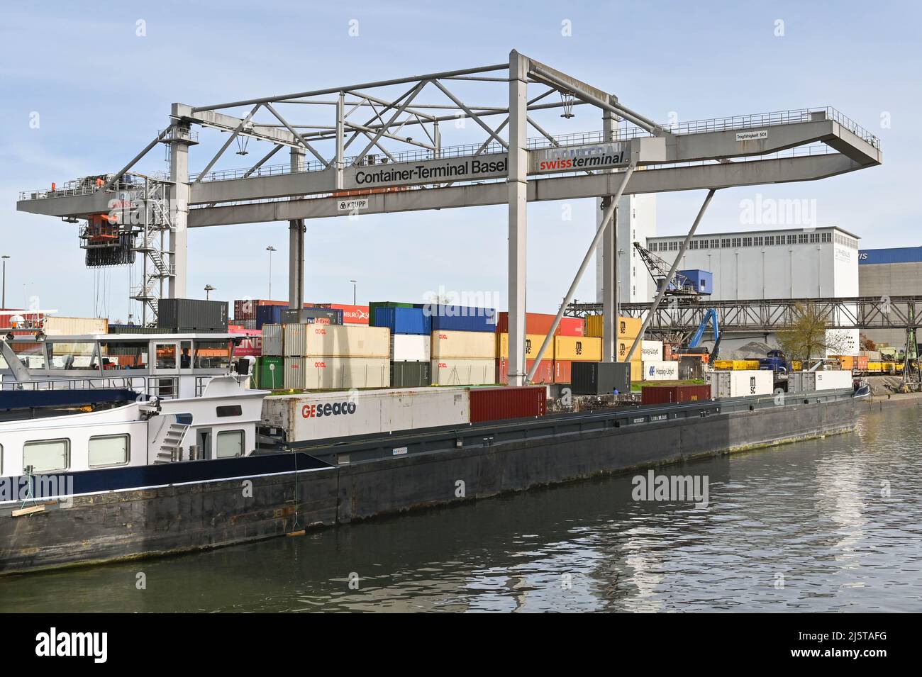 Basel, Switzerland April 2022 Heavy crane in the city's container terminal with an industrial