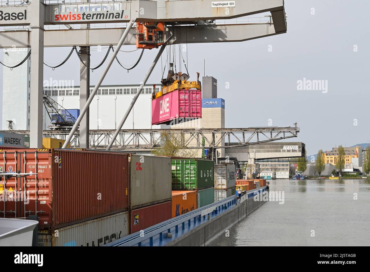 Basel, Switzerland April 2022 Heavy crane in the city's container terminal unloading an