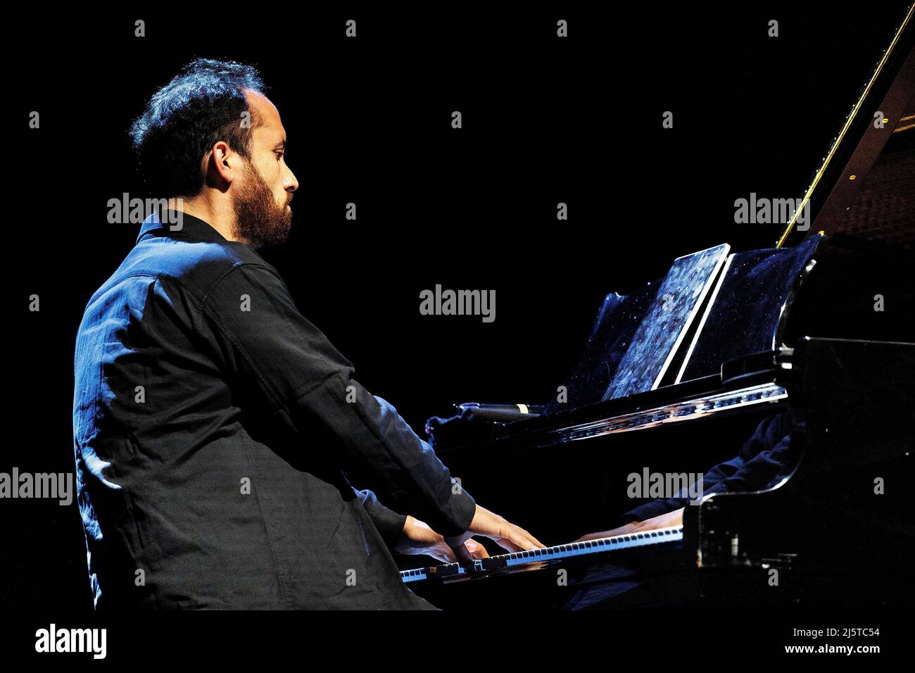 Berlin, Germany. 25th Apr, 2022. Pianist Igor Levit plays at a benefit concert for Ukraine at the Berliner Ensemble. Credit: Carsten Koall/dpa/Alamy Live News Stock Photo