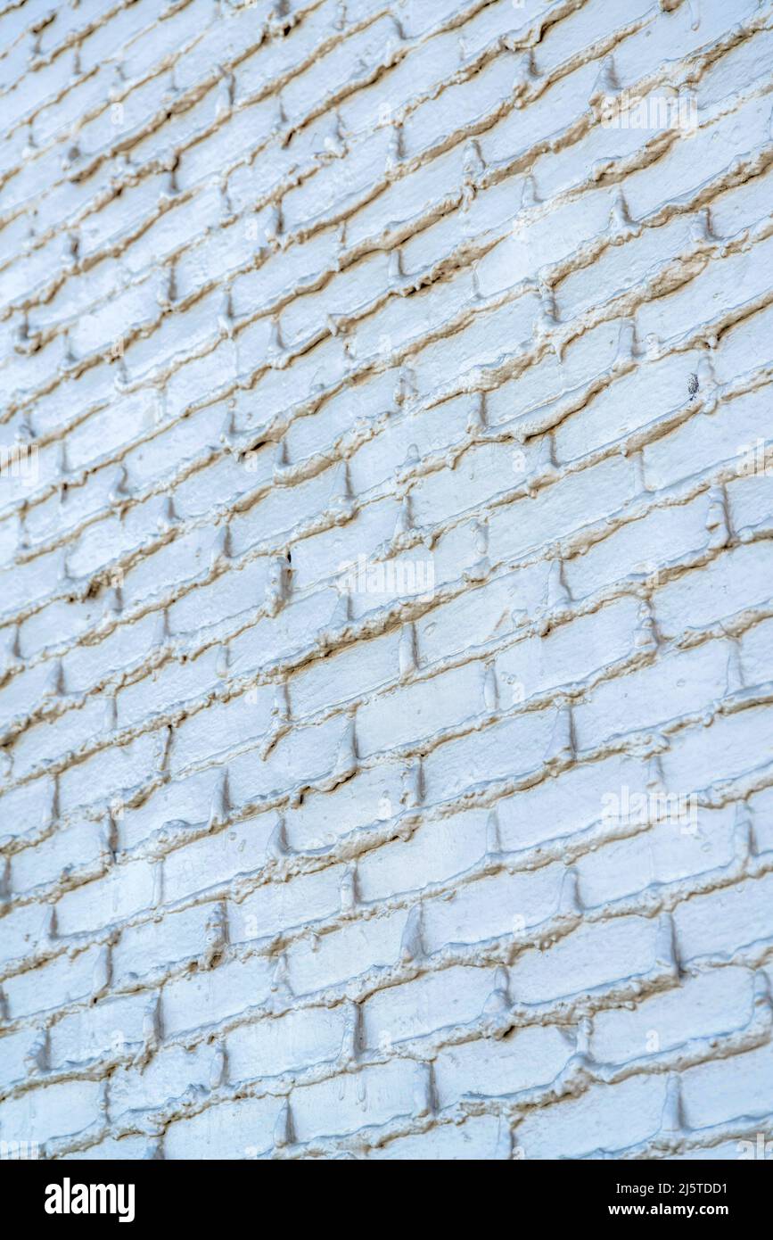 Painted concrete blocks wall with overlapped cement fillers in San