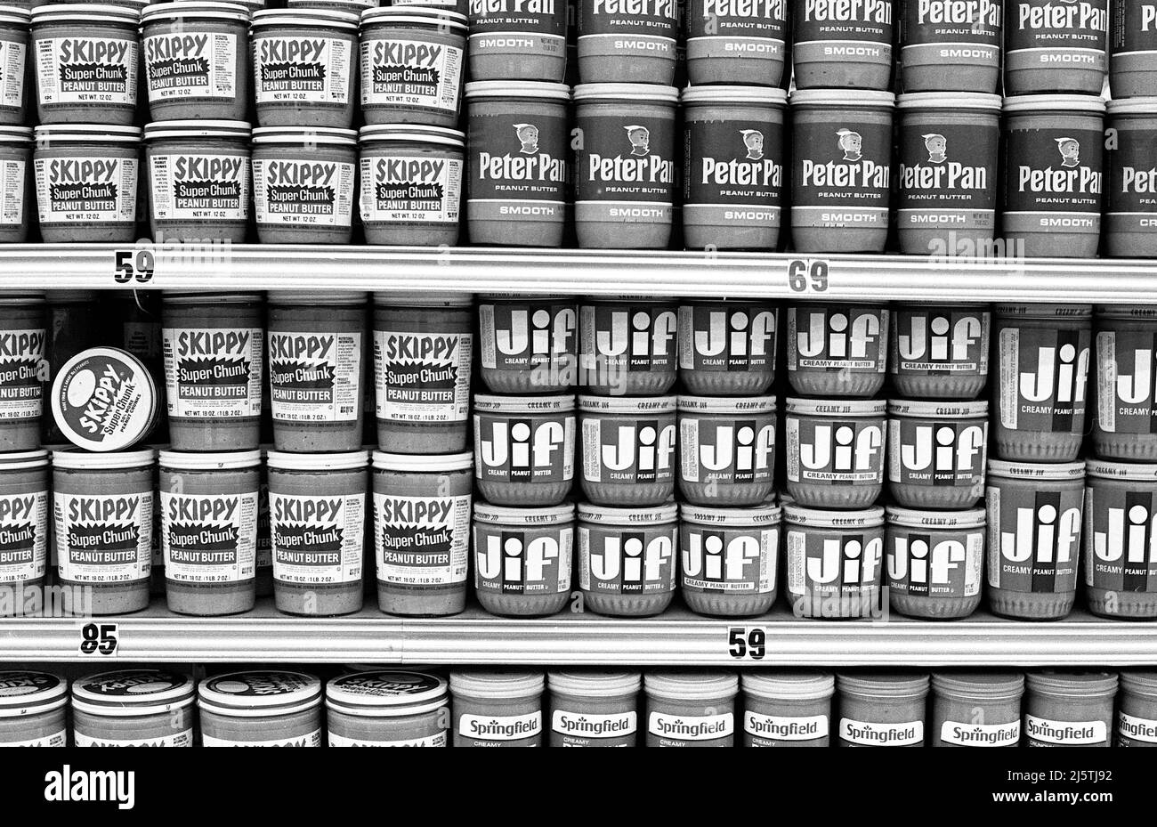 Classic brands of peanut butter on a shelf in supermarket circa 1970s. Stock Photo