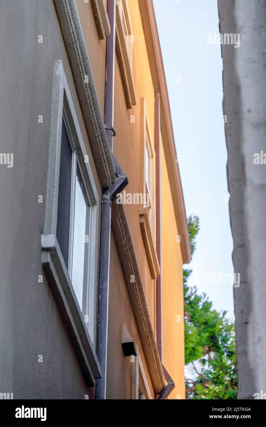 Low angle view of a building with drain pipe on the wall in San Francisco, California Stock Photo