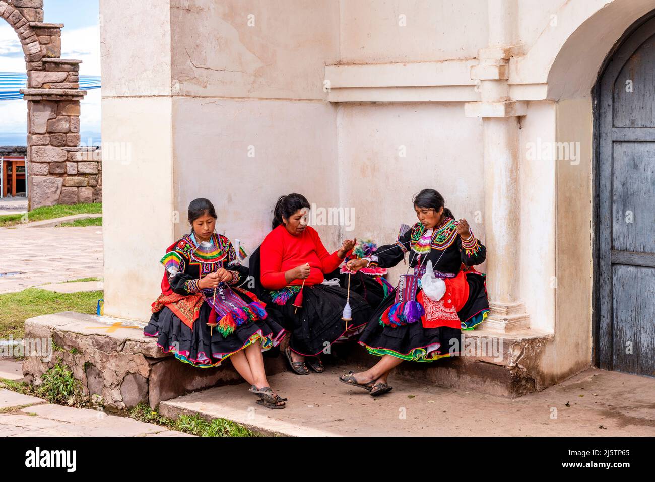 Taquileno Women Spinning Wool, Taquile Island, Lake Titicaca, Puno, Peru. Stock Photo