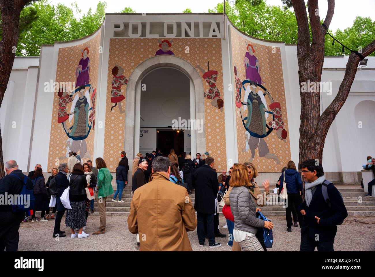 VENICE, ITALY - April 20: Visitors at the Polish Pavilion. The title of the project is: Re-enchanting the World by the artist Małgorzata Mirga-Tas Stock Photo