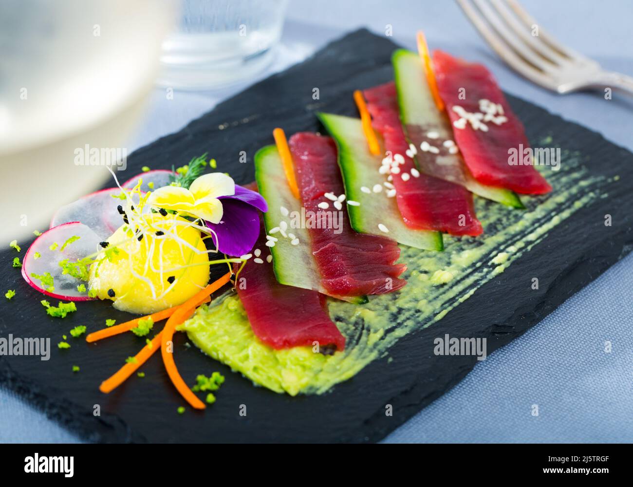Tuna carpaccio with avocado sauce Stock Photo Alamy