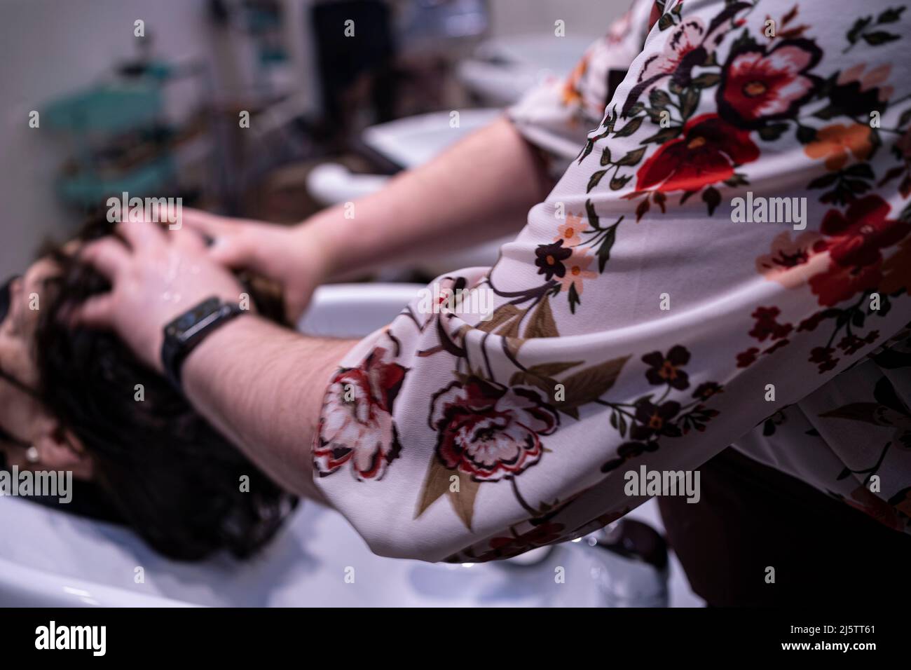 washing hair to an elderly lady in hair salon Stock Photo Alamy