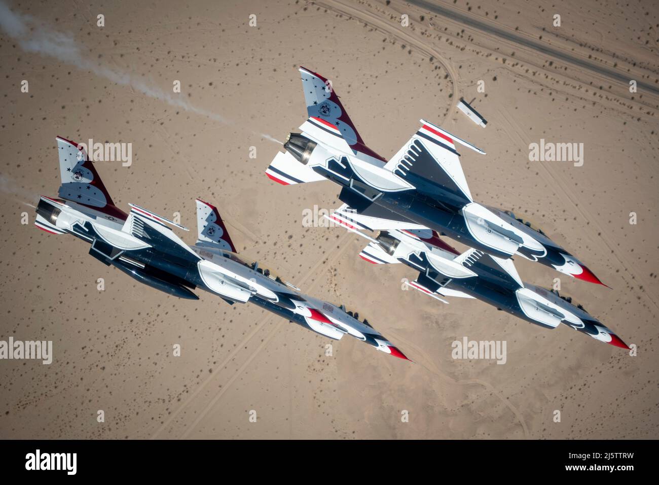 The United States Air Force Air Demonstration Squadron, known as the “ Thunderbirds,” perform joint training over Naval Air Facility El Centro,  California, March 1, 2022. The Thunderbirds and Blue Angels spent a