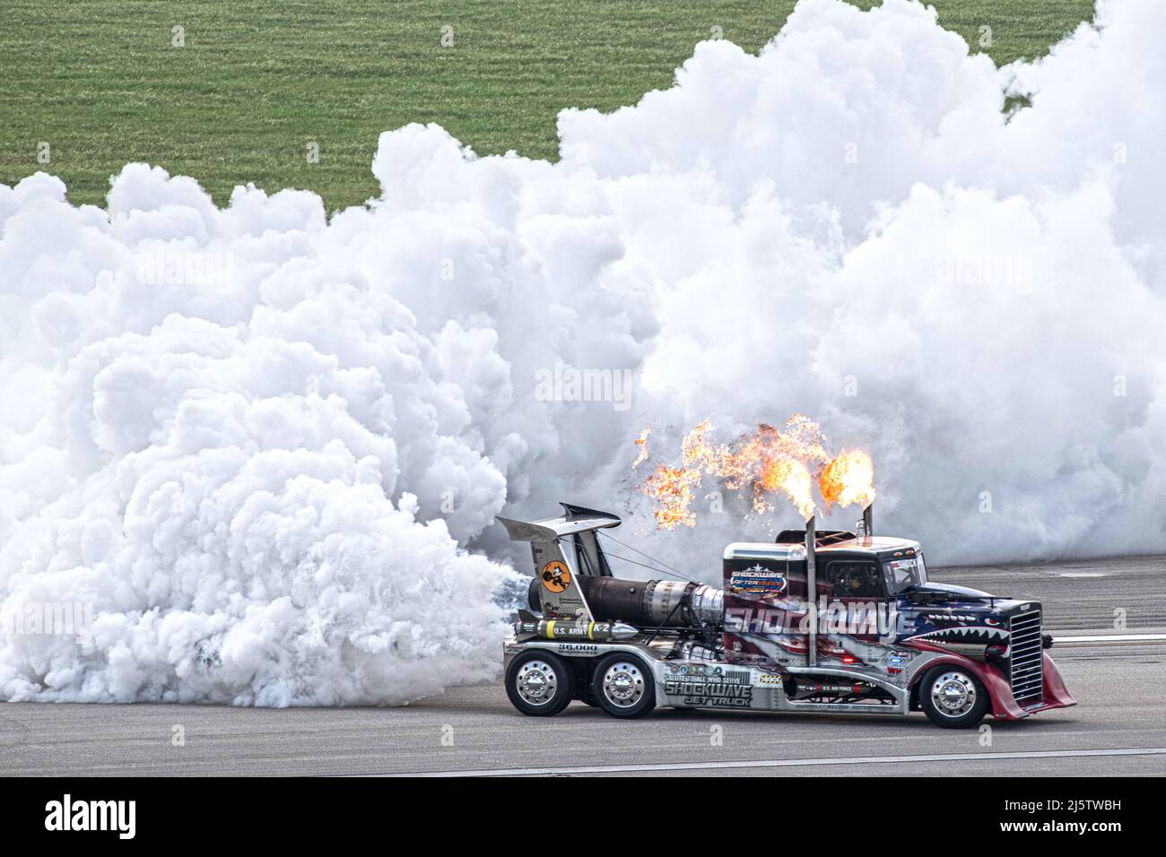 Shockwave races down the runway during The Great Texas Airshow Apr. 22,  2022, at Joint Base San Antonio-Randolph, Texas. Shockwave is a custom  built race truck equipped with three J34-48 Pratt &