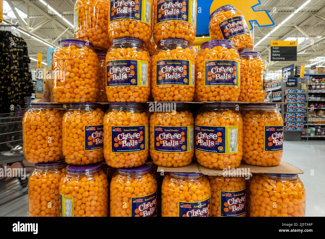 Big stack of Jars, Barrels with Baked Cheddar Cheese Balls by Utz in US supermarket. Stock Photo