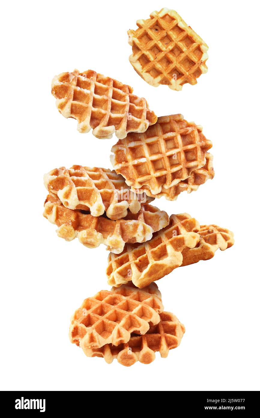 Flying tasty waffles on white background Stock Photo Alamy
