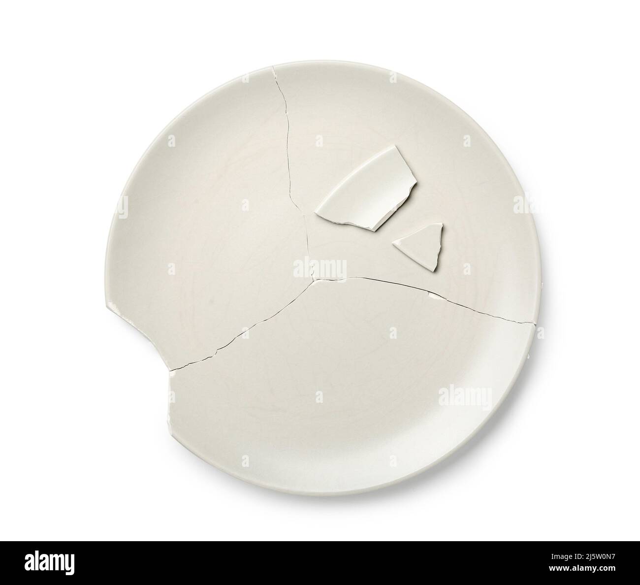 Broken ceramic plate on white background Stock Photo