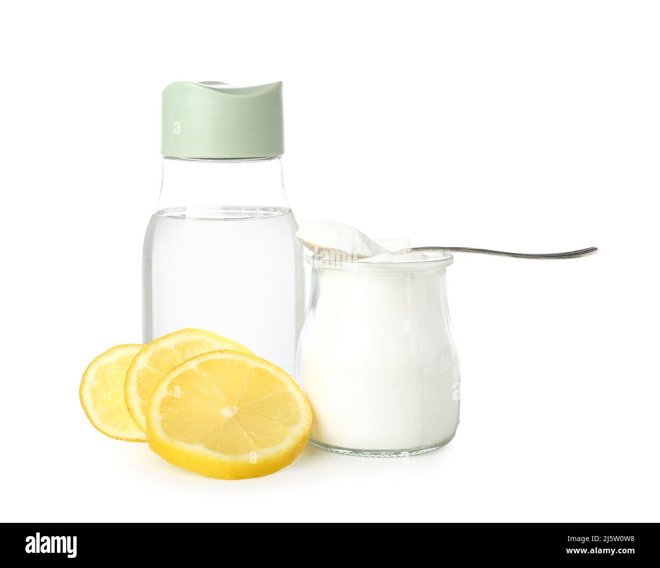 Jar with baking soda, bottle of water and lemon on white background