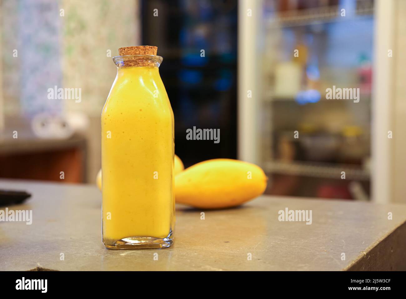 Jug of Mango and Orange Juice with Two Full Glasses Stock Photo - Alamy