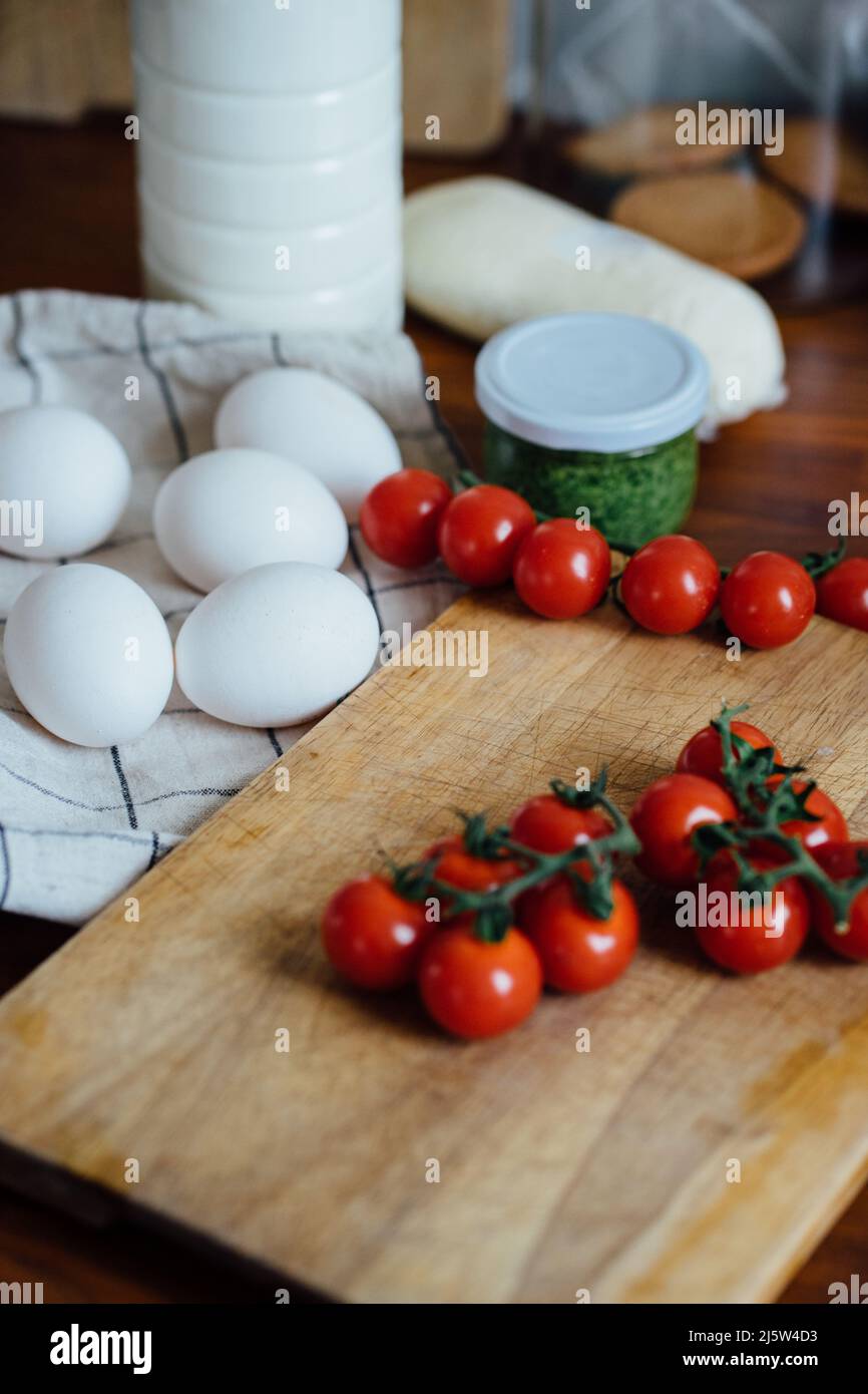 Ingredients for cooking milk, eggs, tomatoes and cheese Stock Photo