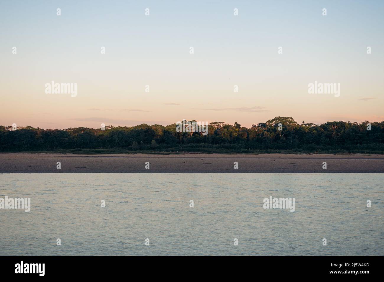 Jungle landscape with river, beach and trees in Tambopata Peru Stock Photo