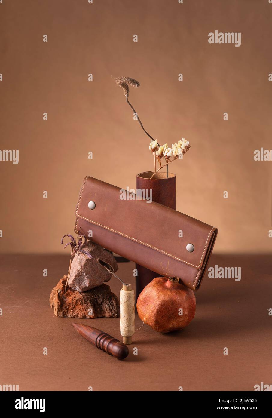 Still life with leather purse and tools. Stock Photo
