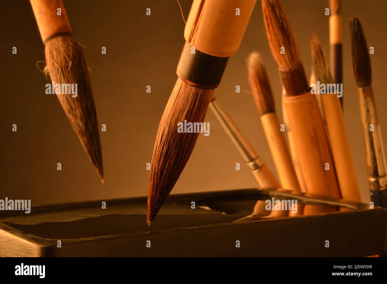 Japanese sumi brushes and inkwell Stock Photo Alamy