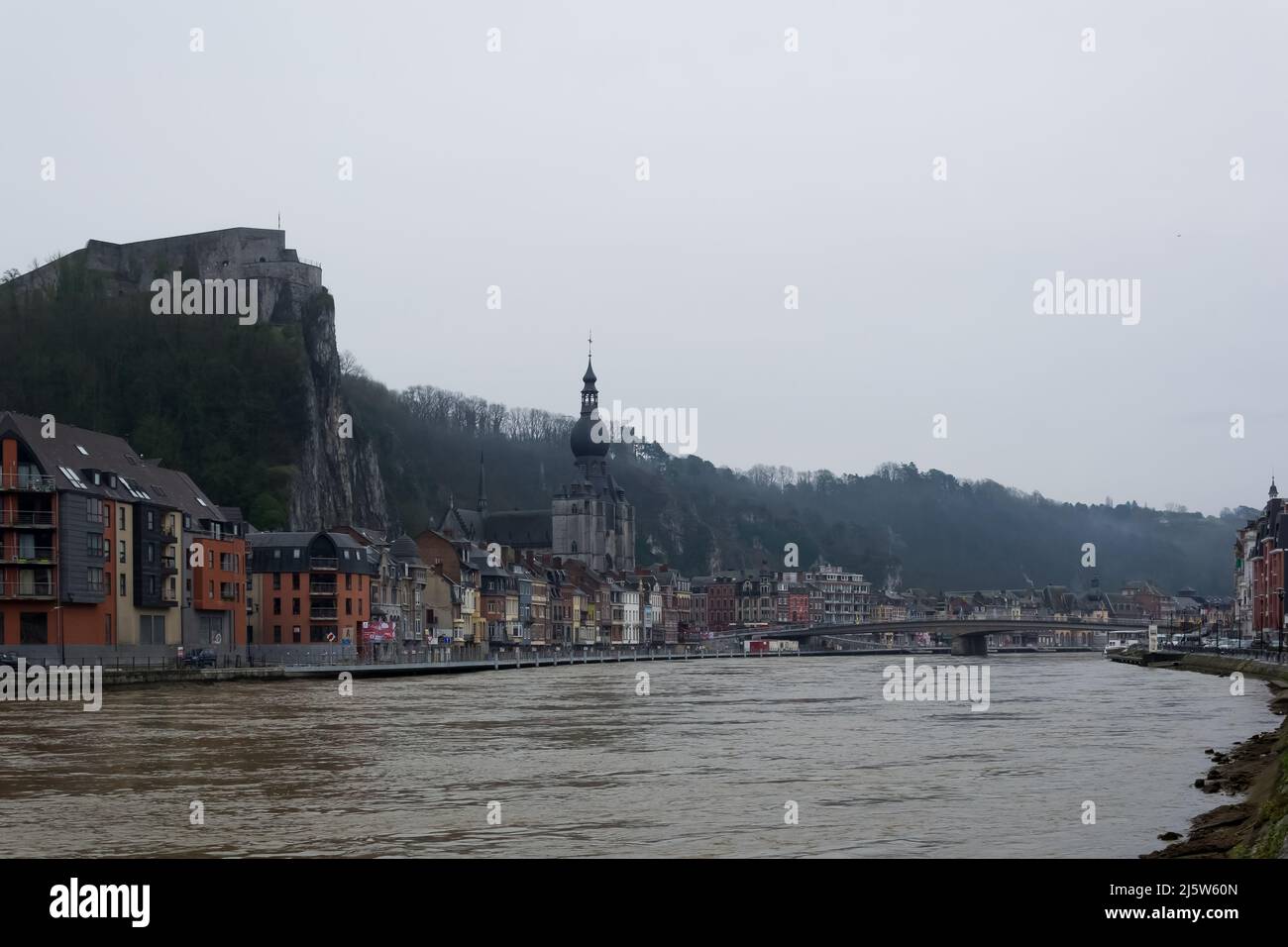 Urban landscape of Dinant, a city and municipality of Wallonia located in the province of Namur on the shores of river Meuse on a cold winter morning Stock Photo