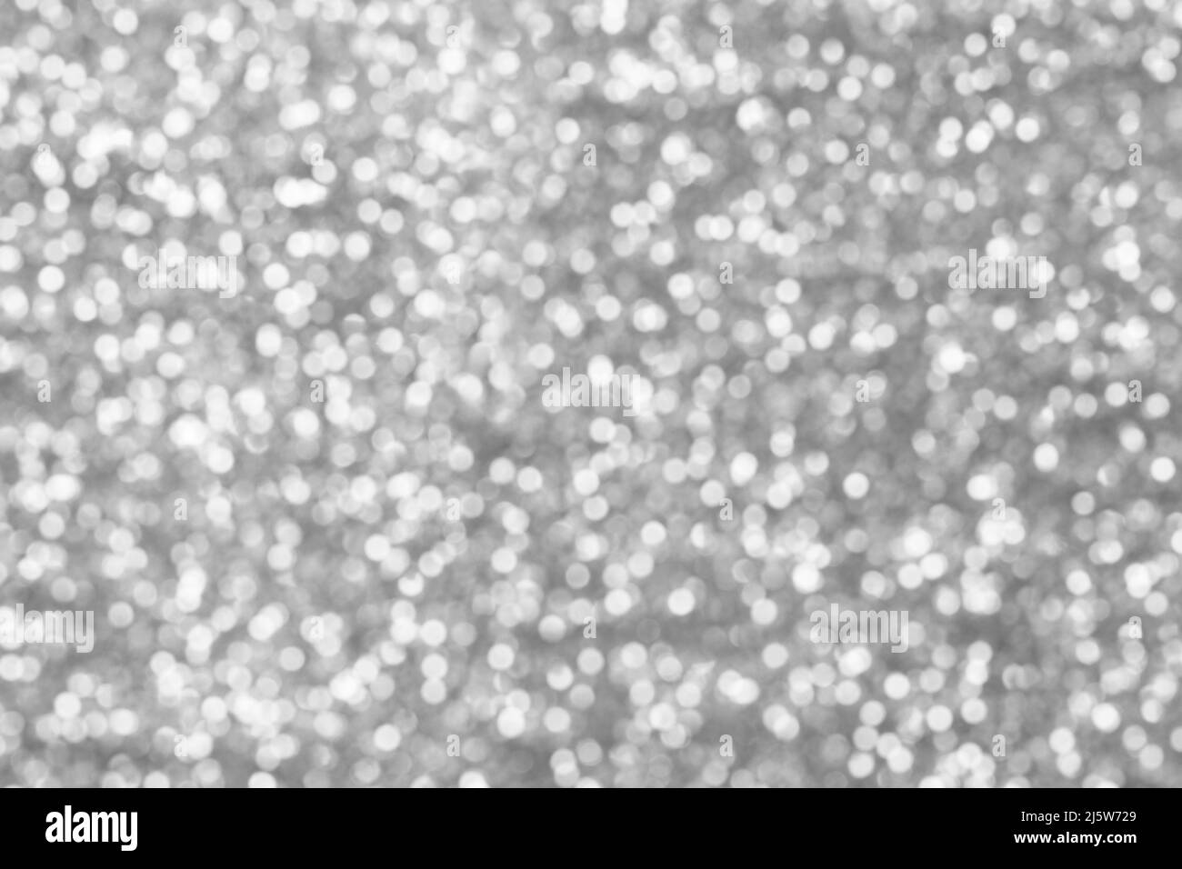 silver bokeh texture. Festive glitter background with defocused lights ...