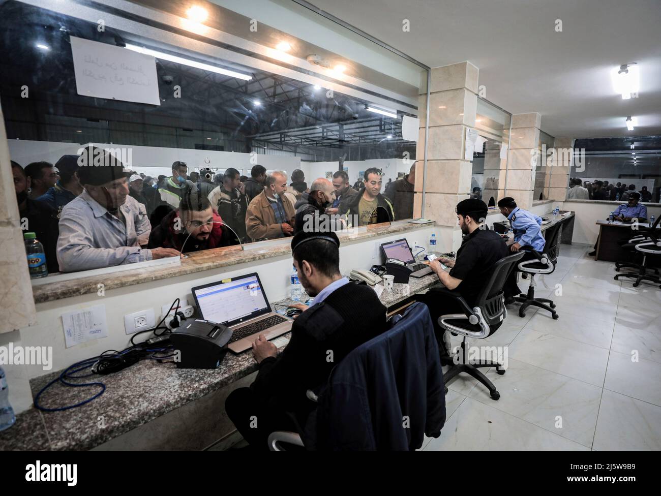 Beit Hanoun, Palestine. 25th Apr, 2022. Palestinian officers verify the identity of workers leaving Beit Hanun in the northern Gaza Strip through the Erez crossing. (Photo by Nidal Alwaheidi/SOPA Images/Sipa USA) Credit: Sipa USA/Alamy Live News Stock Photo