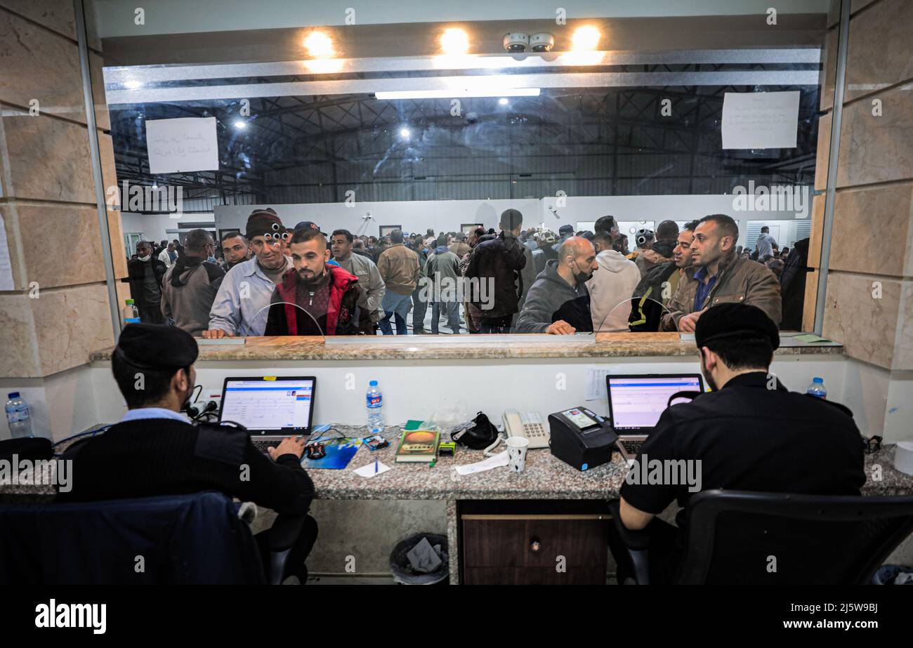 Beit Hanoun, Palestine. 25th Apr, 2022. Palestinian officers verify the identity of workers leaving Beit Hanun in the northern Gaza Strip through the Erez crossing. (Photo by Nidal Alwaheidi/SOPA Images/Sipa USA) Credit: Sipa USA/Alamy Live News Stock Photo